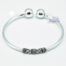 Pulsera de Plata Tubo con Labrado en el centro y Bolitas en los extremos